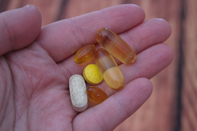 A portrait of some capsules as example of vitamin capsule for healthy hair