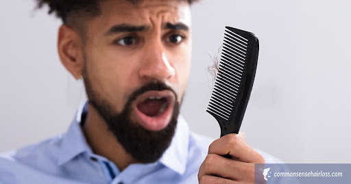A man became worried after seeing loosen hair on comb