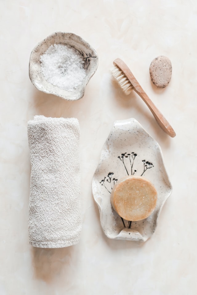 An image containing towel, soap and others bathing accessories