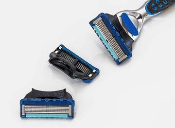 A portrait of a shaving razor with two blades