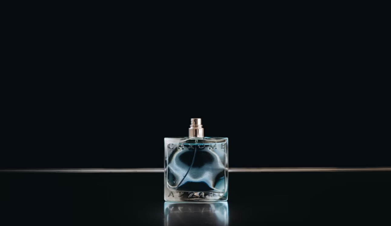 A sample image of a man's perfume bottle in dark background