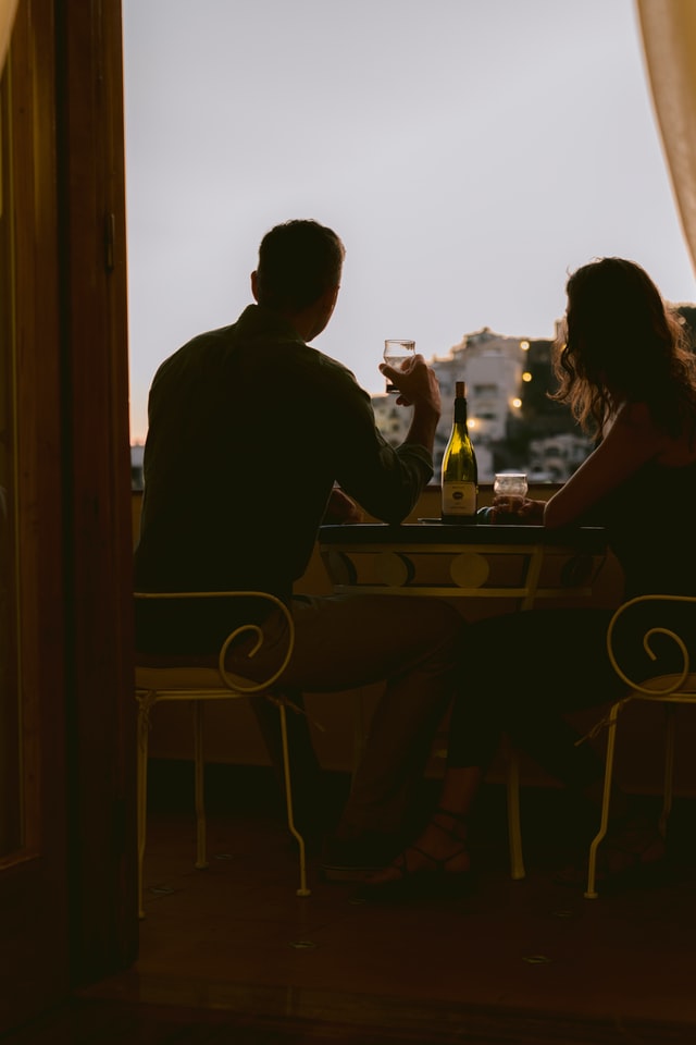 A couple watching outside view sitting in restaurant 